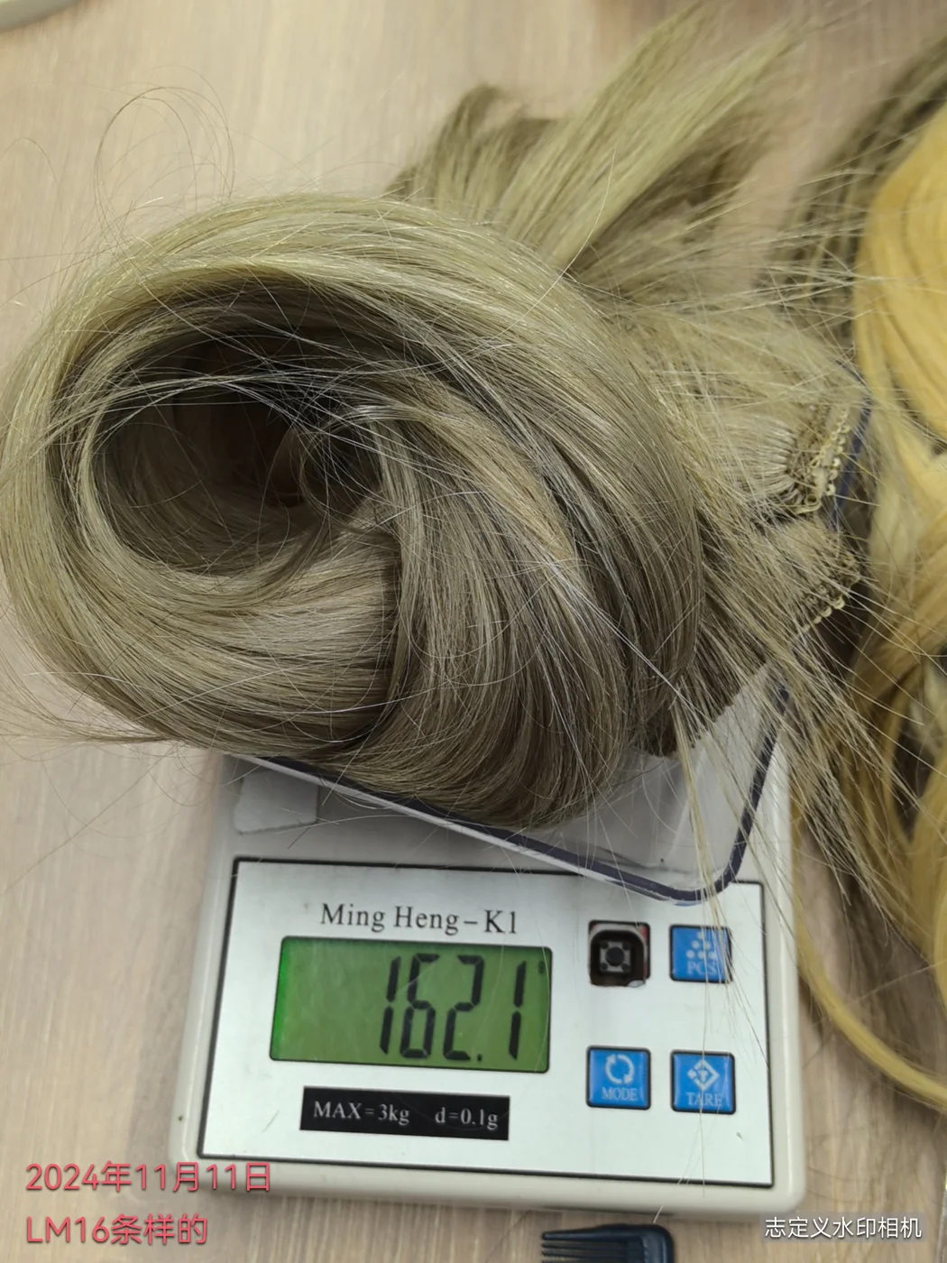 Weighing a hair sample during inspection.
